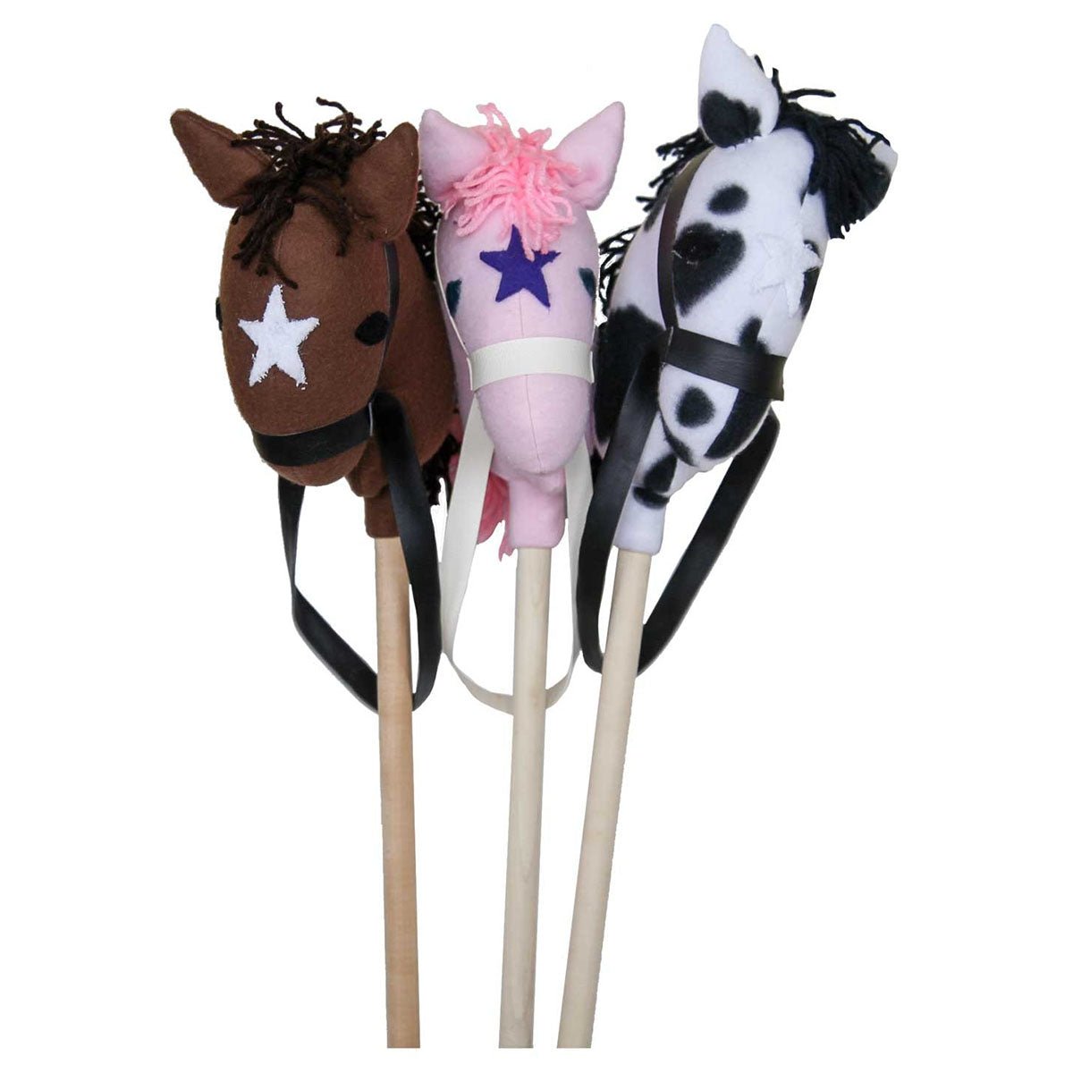 Three plush stick horses on wooden dowels in brown, pink and black-spotted white, each with yarn mane and reins