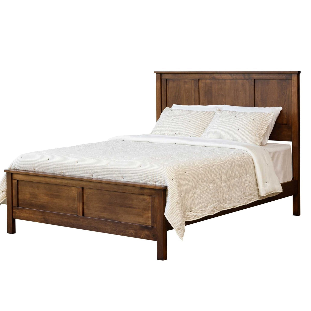 Solid wood panel bed with matching low paneled footboard and cream striped quilt on a white background