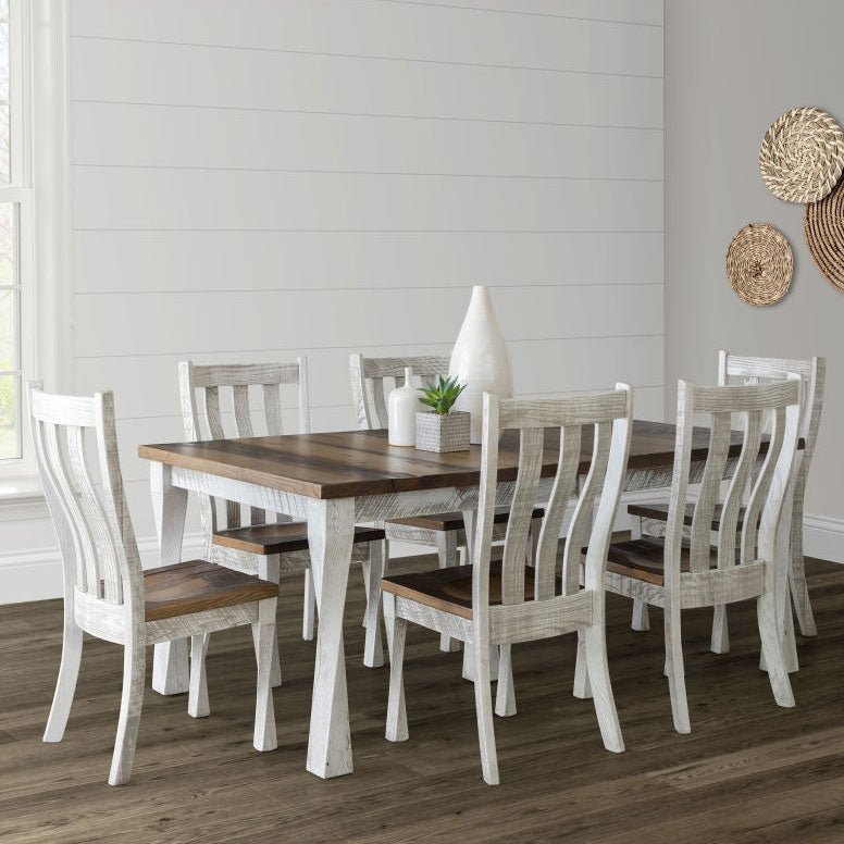 Farmhouse dining set with a reclaimed wood plank top, whitewashed legs and six slat back chairs against white shiplap