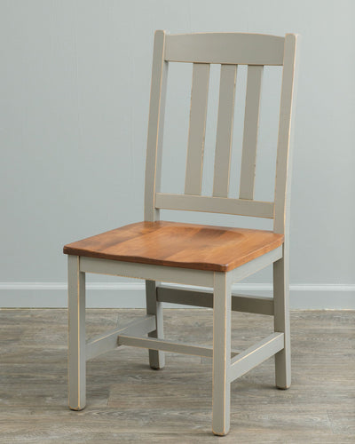 Gray painted dining chair with three back slats and a contrasting natural wood saddle seat