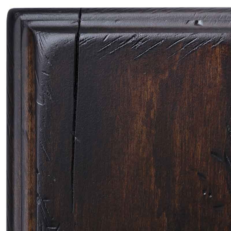 Detail of the Antiquated Briar brown maple sample corner, dark chocolate stain with chiseled distress nicks along the molding