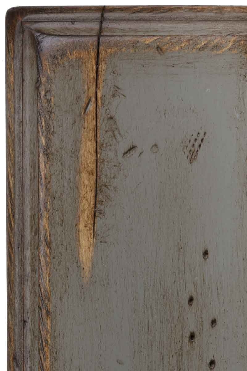 Antiquated Chelsea Gray on brown maple, a soft gray painted panel with sanded rub-through showing tan wood, worm holes and a check