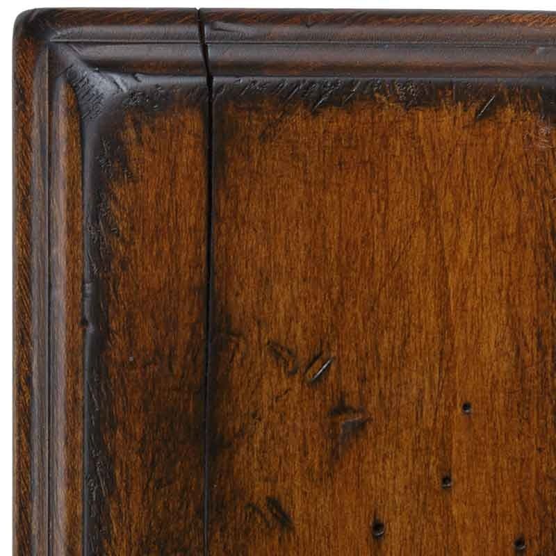 Harvest antiqued finish detail on maple, warm golden brown with blackened distress marks, worm holes and a rounded molded edge