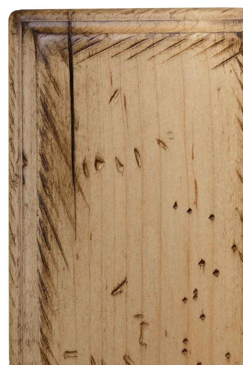 Antiquated Natural on brown maple, a light tan unstained panel with dark chisel distressing, worm holes and a fine check