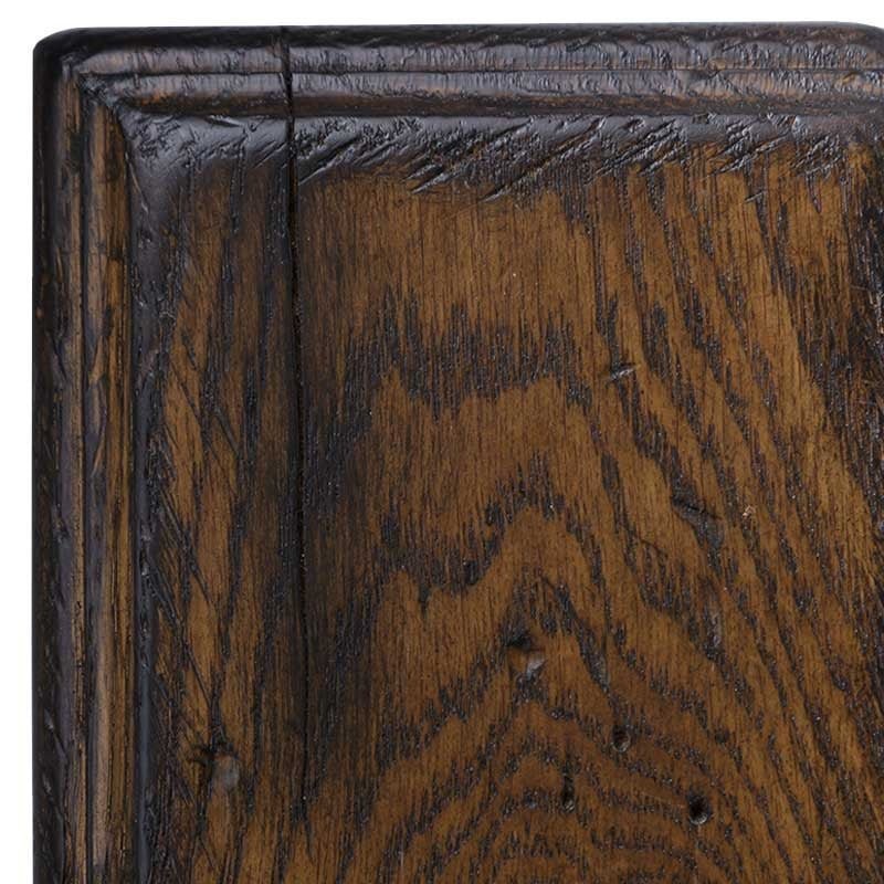 Cappuccino antiqued rustic oak swatch, warm brown finish with heavy black grain contrast and a distressed molded corner