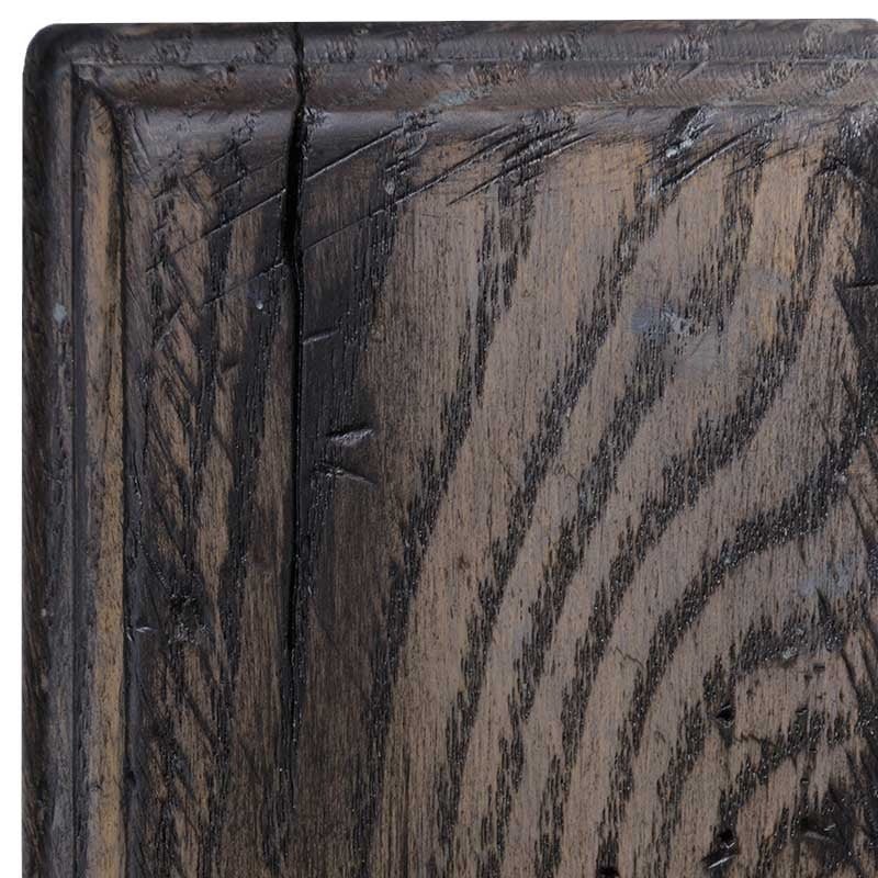 Rustic oak in Antiquated Pewter, gray weathered stain with bold dark grain figure and chiseled distressing at the molding