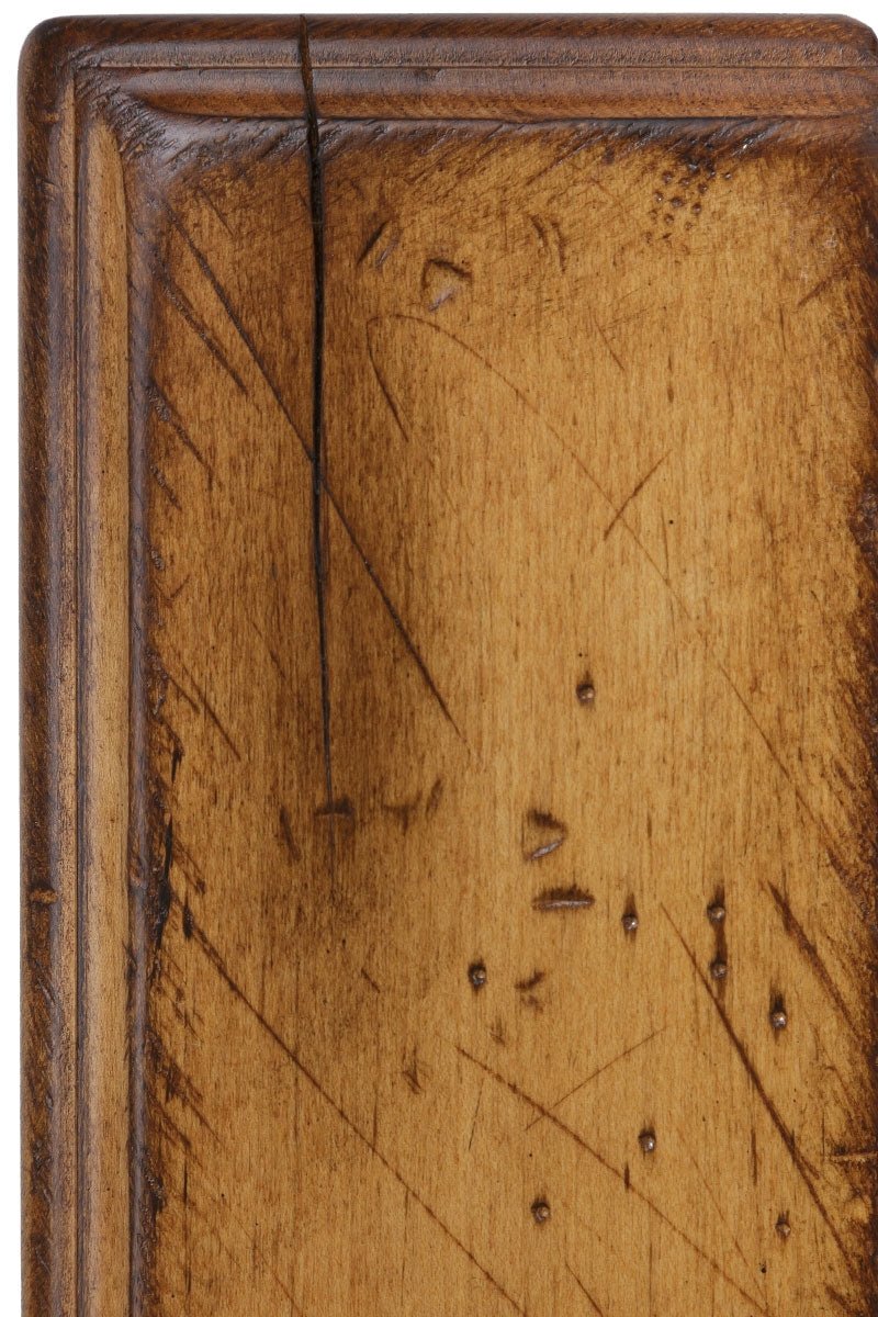 Antiquated S-2 on brown maple, a honey-gold panel with scattered scratch distressing, worm holes and a hairline check