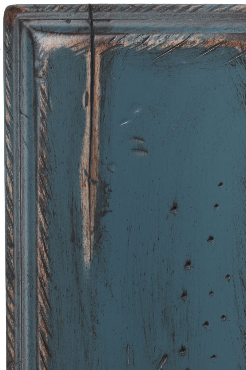 Antiquated Royal Blue on brown maple, a deep teal-blue painted panel with sanded tan rub-through, worm holes and a check