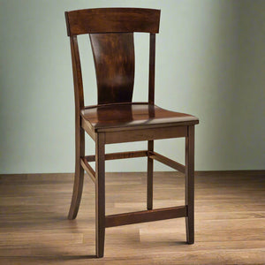Baldwin lumbar back bar stool in warm brown maple with curved panel back, saddle seat and footrest stretchers