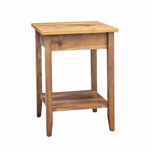 Small square corner table in wormy maple with tapered legs and a lower display shelf on a white background