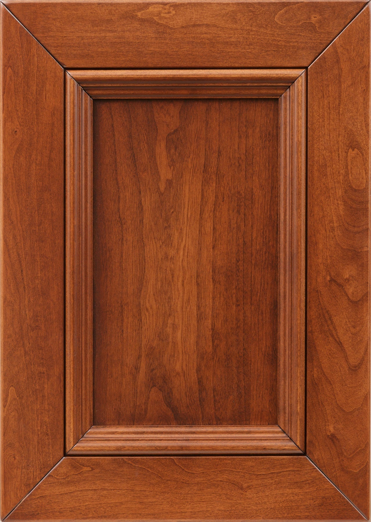 Bordeaux stain sample on cherry showing a warm reddish cinnamon tone with visible grain on a raised panel door