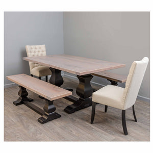 Trestle dining set with a weathered gray top, black bases, plank bench and two linen upholstered side chairs
