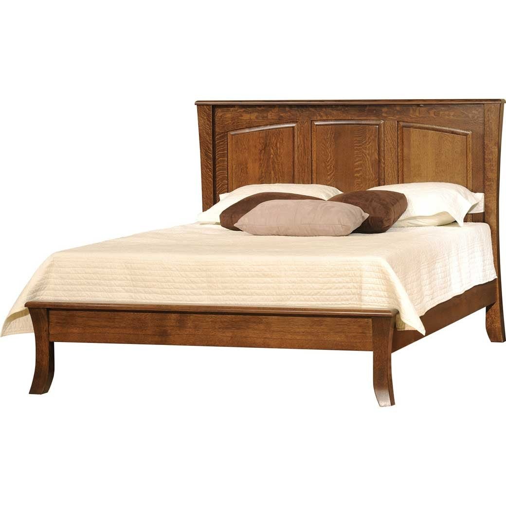 Convertible crib converted to a full bed with a three panel arched headboard in warm oak and cream quilted bedding