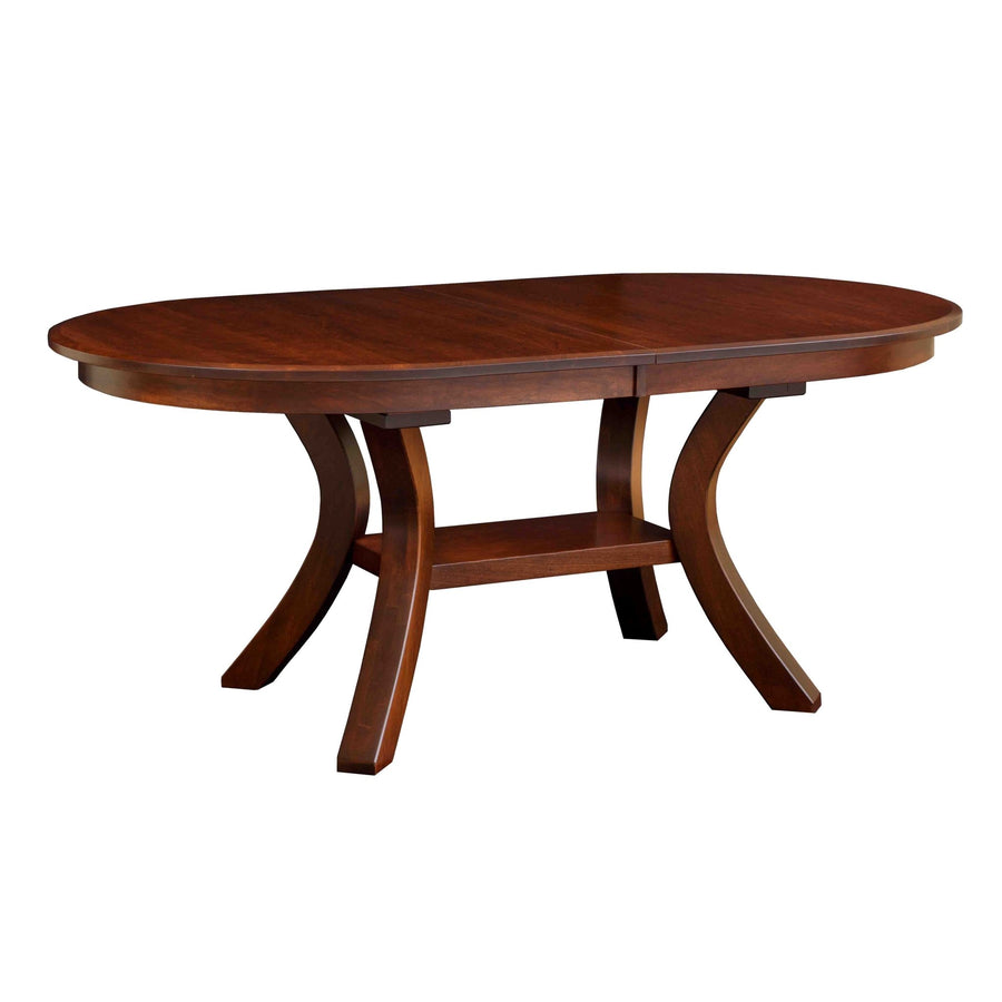 Cherry finished oval pedestal dining table with curved splayed legs and a shelf stretcher on a white background