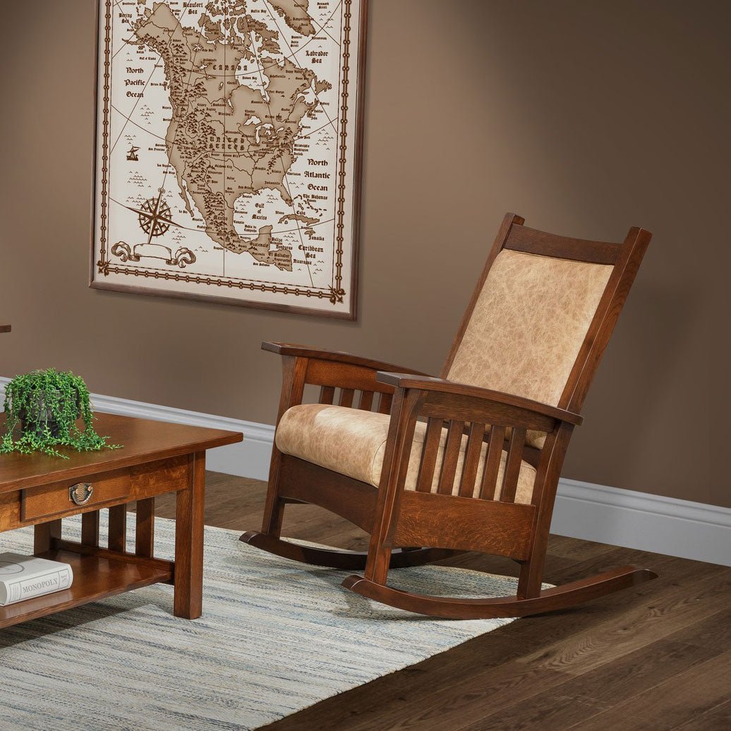 Mission oak rocking chair with tan distressed leather back and seat cushions, slat sides and curved rockers