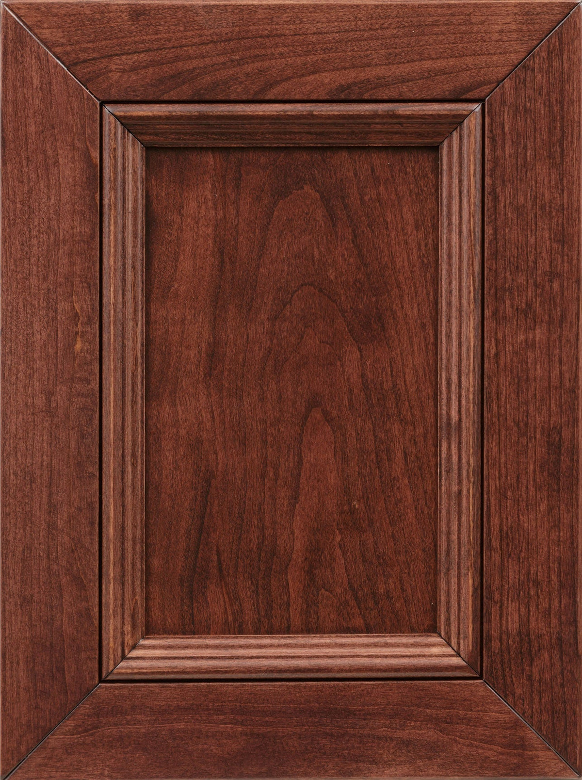 Cordovan stain on cherry sample, a deep reddish burgundy raised-panel cabinet door with mitered frame and grooved molding