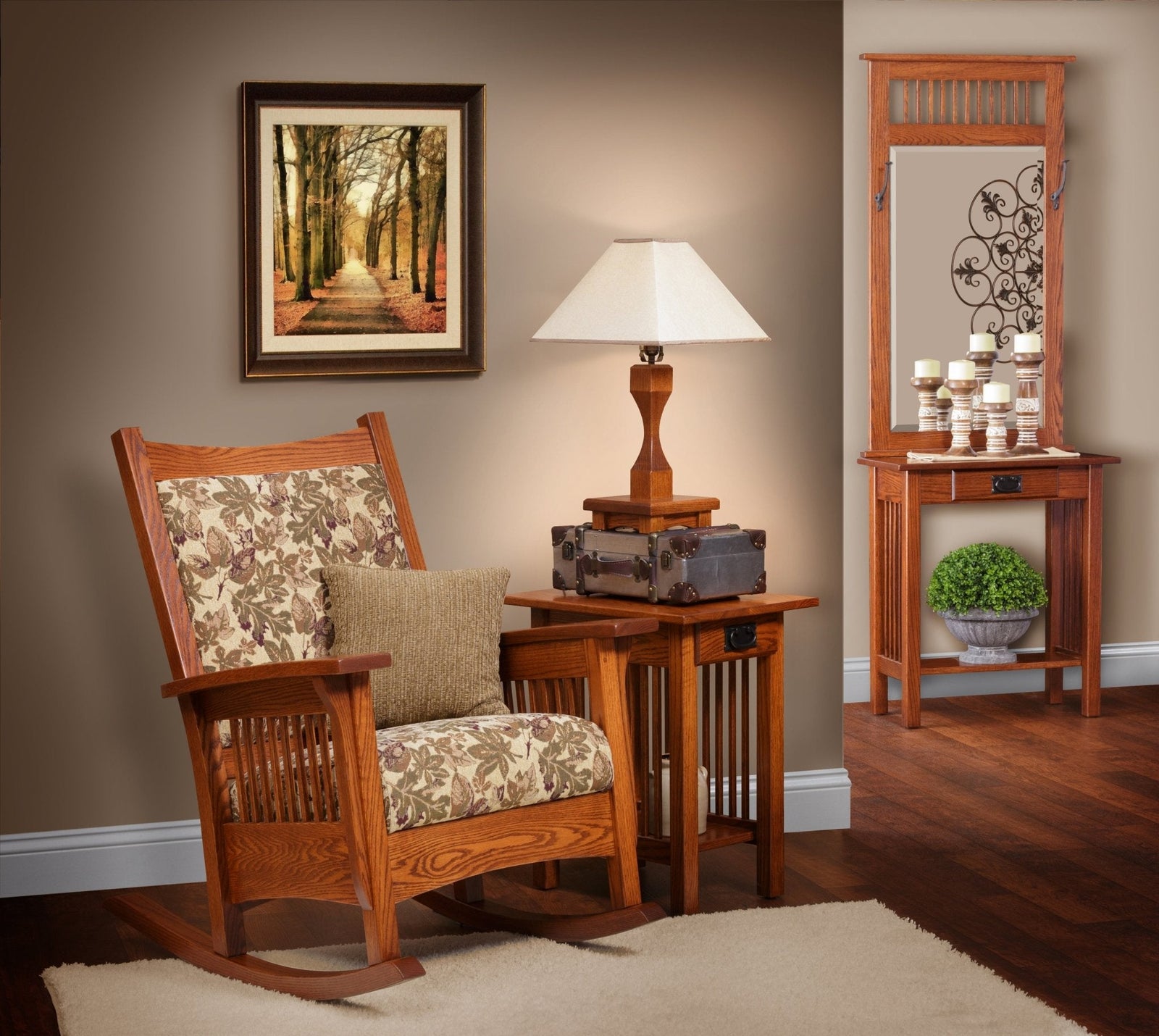Mission style oak rocking chair with floral upholstered seat and back, vertical side slats and curved rockers in a living room