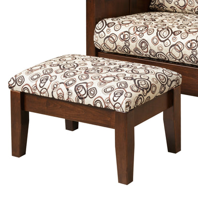 Close-up of a cherry Shaker ottoman with cream circle-print upholstered top and square tapered legs beside a matching Morris chair