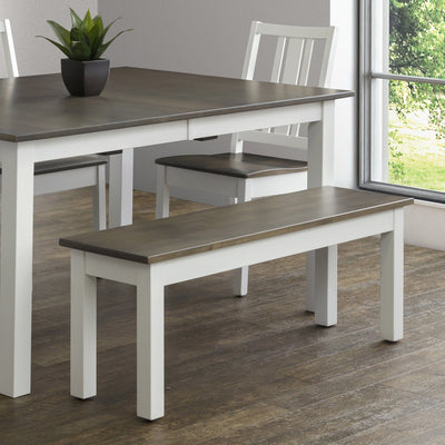 White painted 48 inch dining bench with a gray stained top beside a matching two-tone dining table