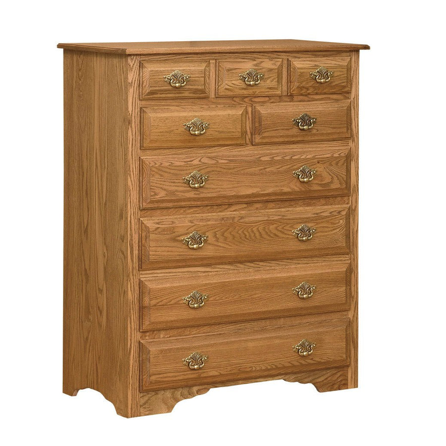 Large nine-drawer oak chest with three small top drawers, brass colonial pulls and a shaped base
