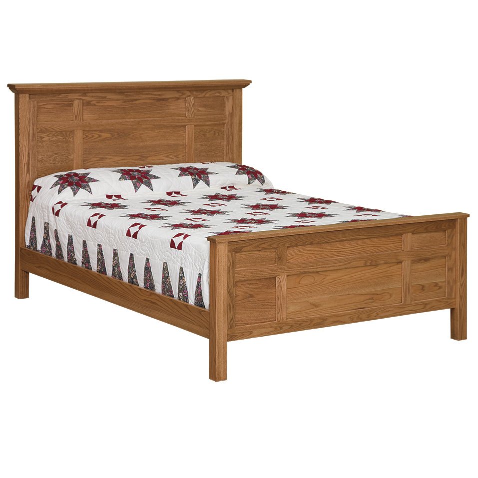 Multi panel oak bed with a segmented panel headboard and matching footboard, dressed in a star quilt