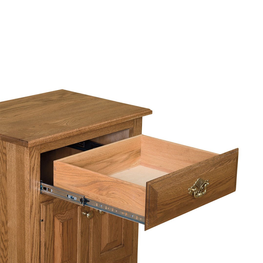 Open dresser drawer on full-extension metal glides showing solid oak drawer sides and a brass bail pull