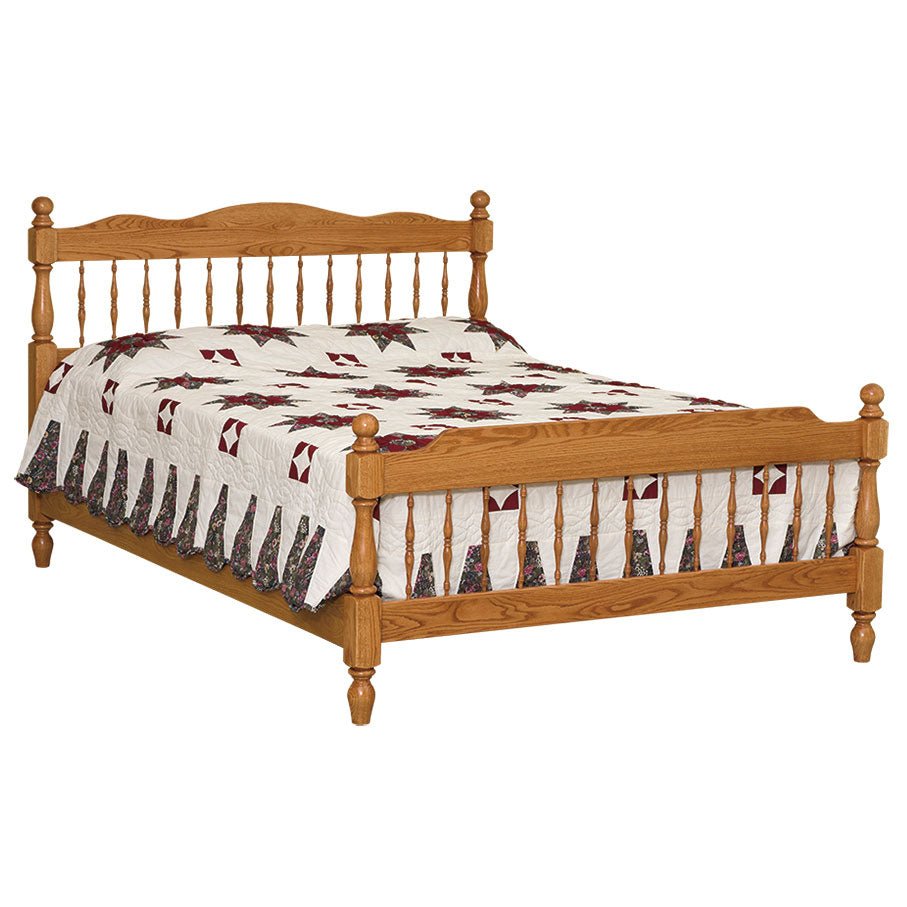 Oak spindle bed with turned posts, ball finials and rows of turned spindles, made up with a star quilt