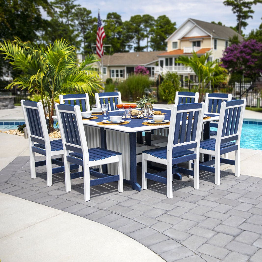Navy blue and white poly square patio dining table with eight slat back chairs set for lunch beside a pool