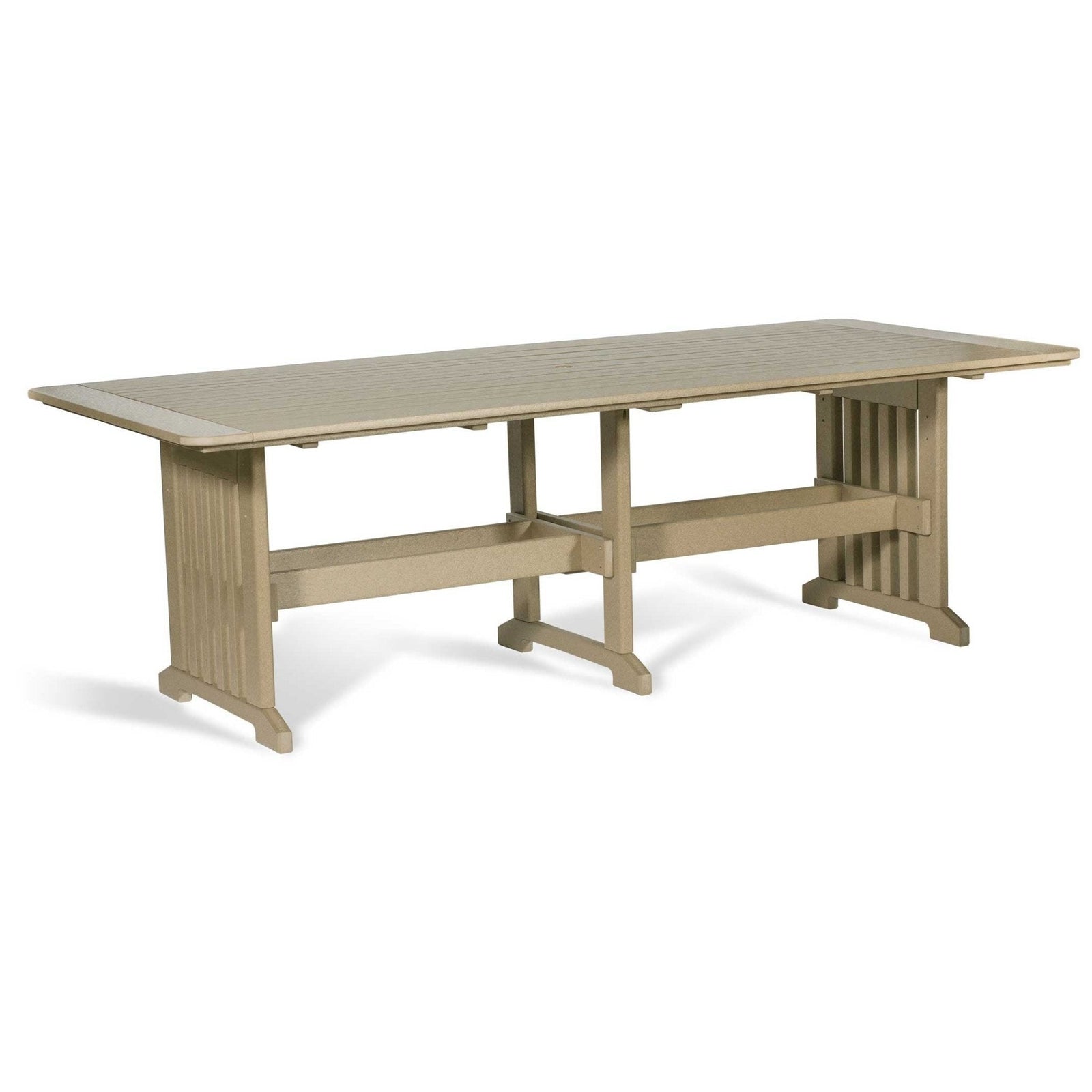 Tan poly 96 inch outdoor dining table shown at an angle with slatted top, umbrella hole and trestle base