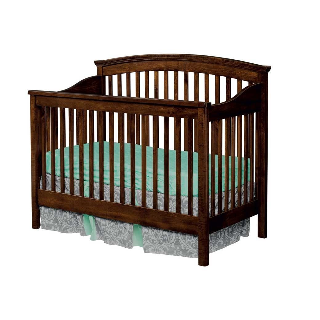 Dark brown stained convertible crib with a curved arched top rail, rounded slats and mint green bedding