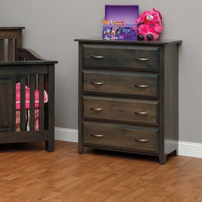 Hartford 4-drawer chest of drawers in gray stain beside a matching crib, topped with a keepsake box and stuffed toys in a nursery
