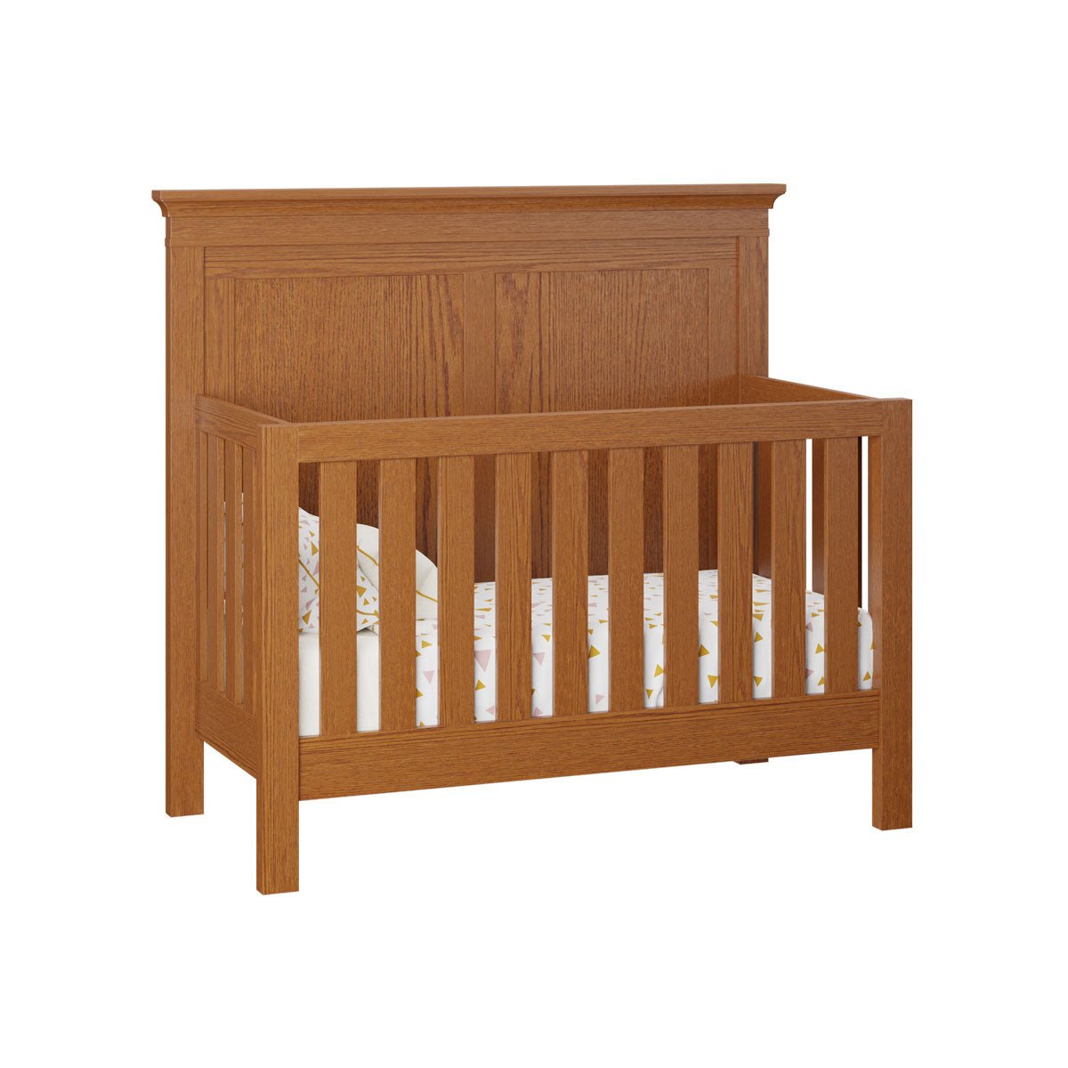 Honey oak convertible crib with a two panel headboard, molded cap rail and slatted front on a white background
