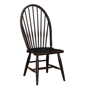 High back Windsor dining chair in distressed black with bowed spindle back and a scooped saddle seat