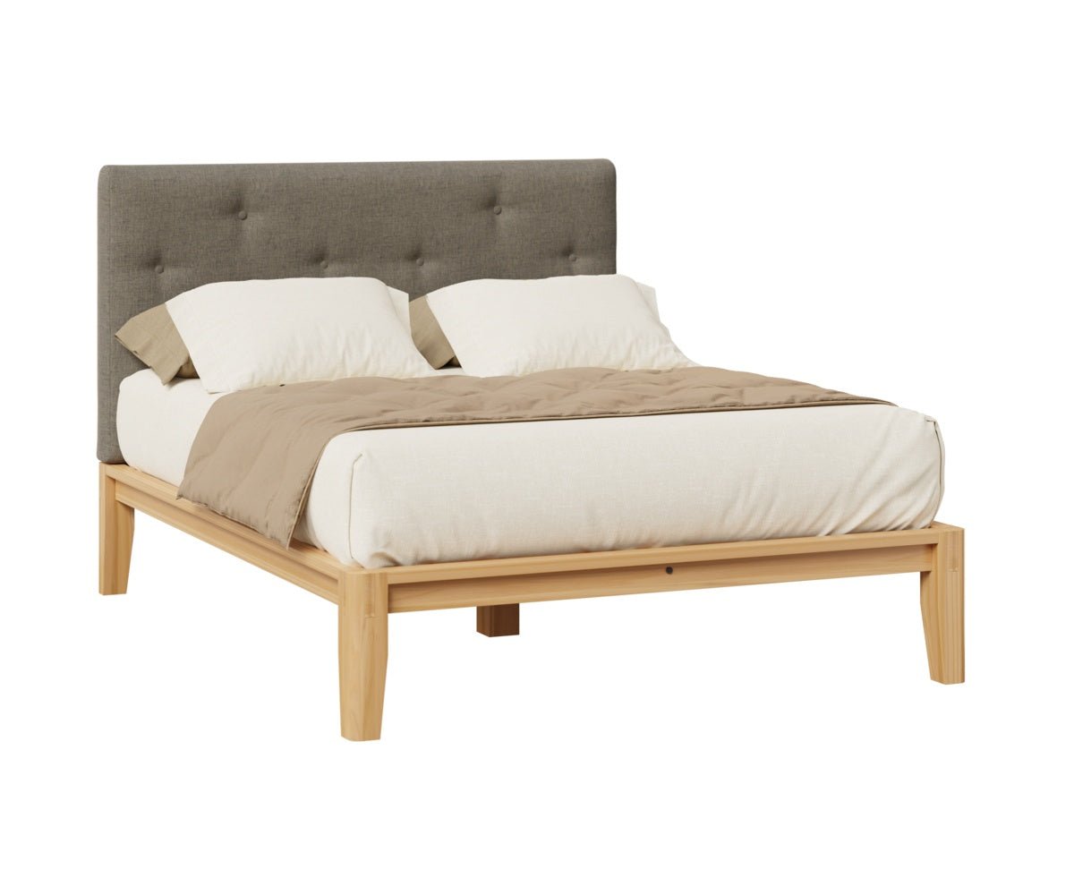 Queen platform bed with button tufted gray fabric headboard, natural wood rails and tapered legs on a white background