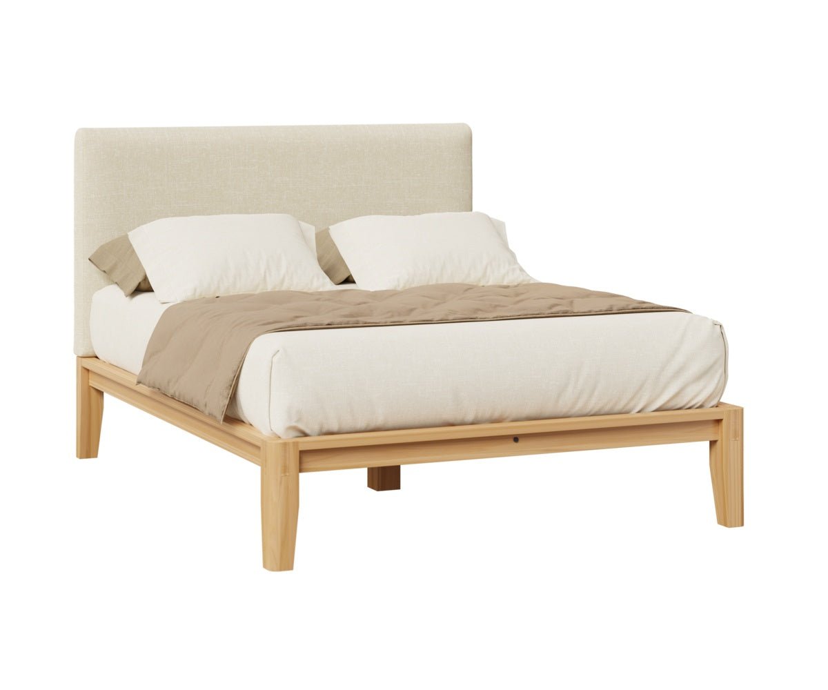 Platform bed featuring an ivory linen upholstered headboard on a light wood frame with low rails and angled legs
