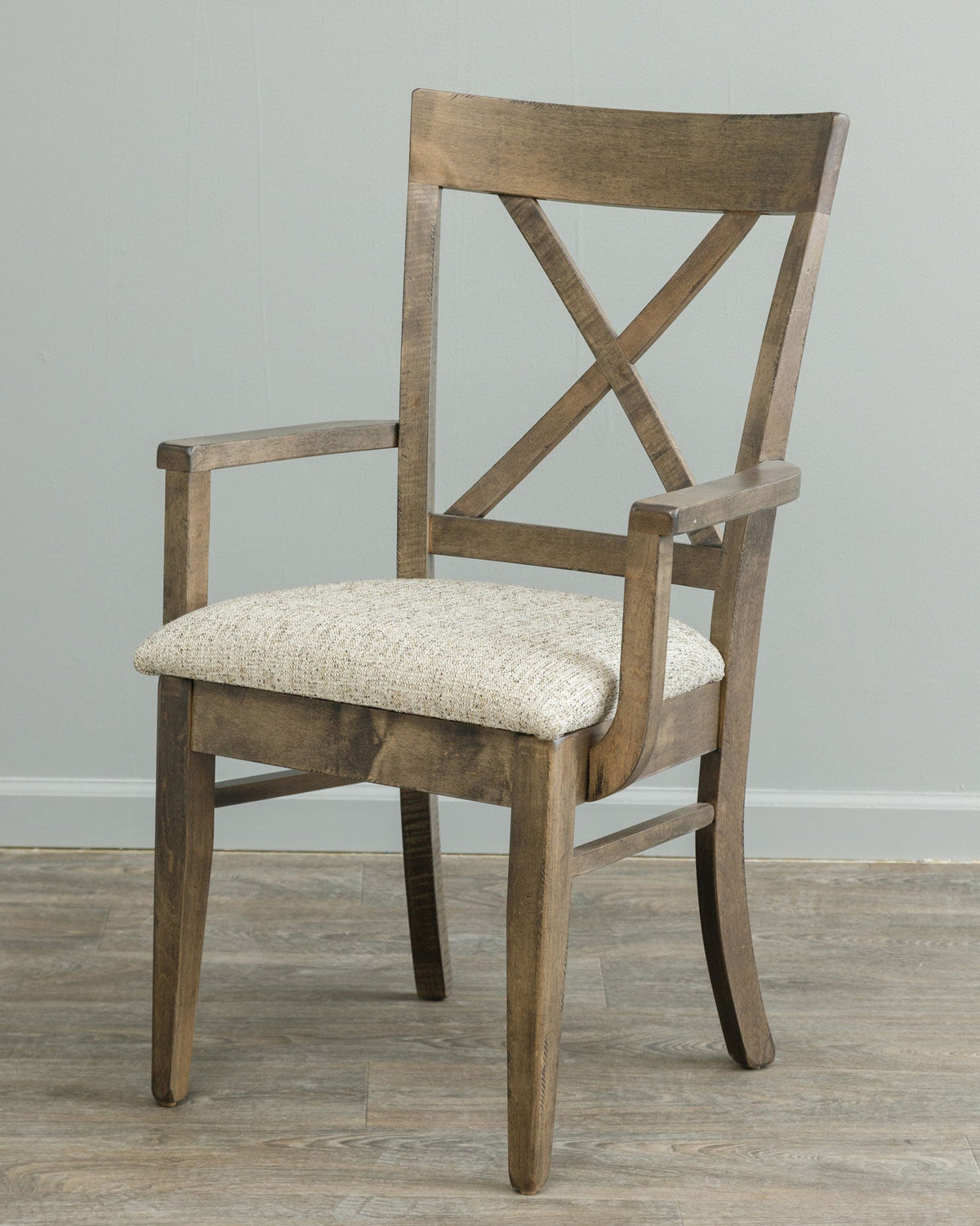 Rustic brown X back dining arm chair with cream tweed upholstered seat, open arms and tapered square legs