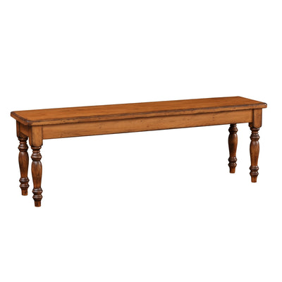 Honey stained dining bench with a plank seat, beveled edge and four turned legs on a white background