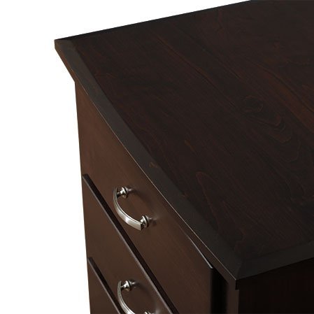 Corner detail of the espresso chest top showing the beveled edge and nickel bail pulls below