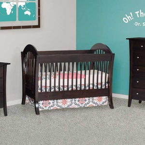 Espresso sleigh style convertible crib with arched slatted ends and flared feet in a teal and gray nursery