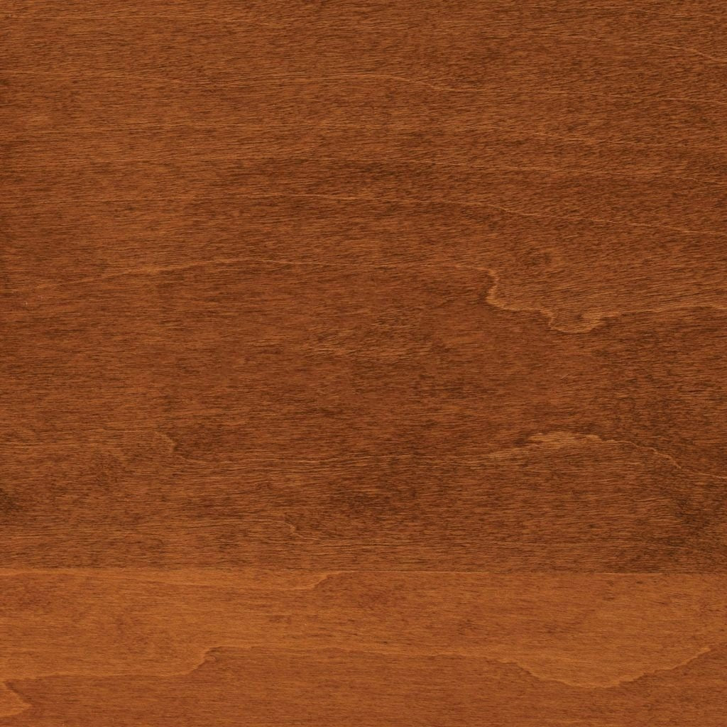 Micheals stain on maple, a medium reddish caramel swatch with soft cloudy grain variation