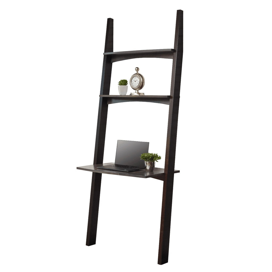 Ladder style wall leaning desk in dark finish with two shelves, a clock, plant and laptop on the desk top