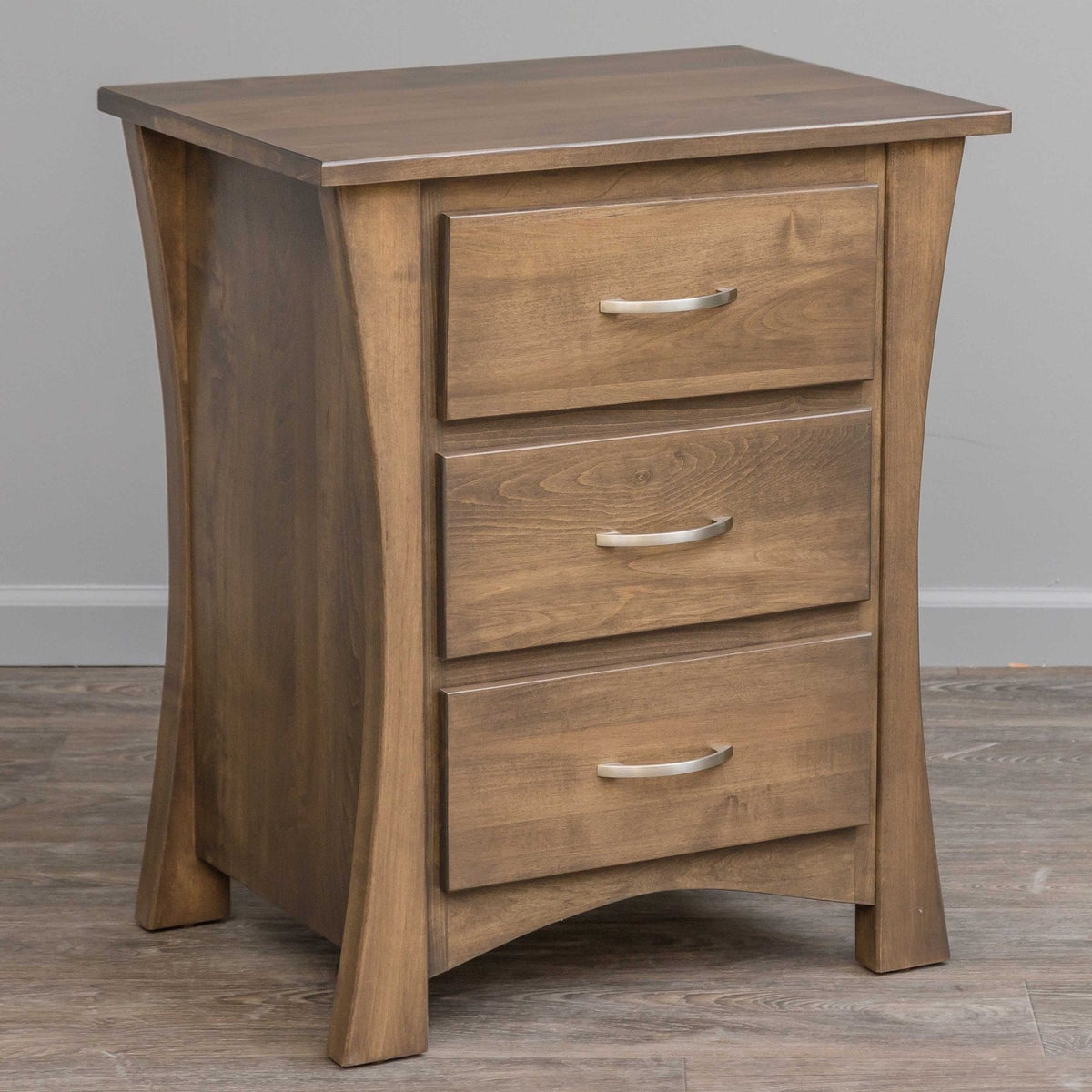 Three drawer nightstand with dramatic curved side legs, satin nickel pulls and a warm gray brown finish
