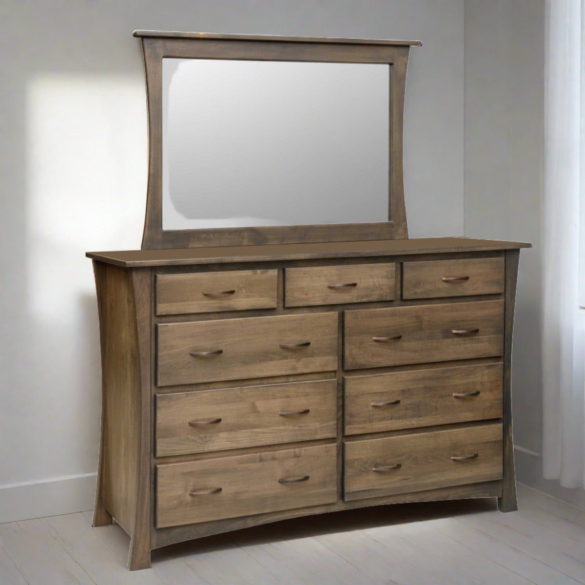 Nine drawer dresser with curved side panels and a wide mirror in a weathered driftwood finish