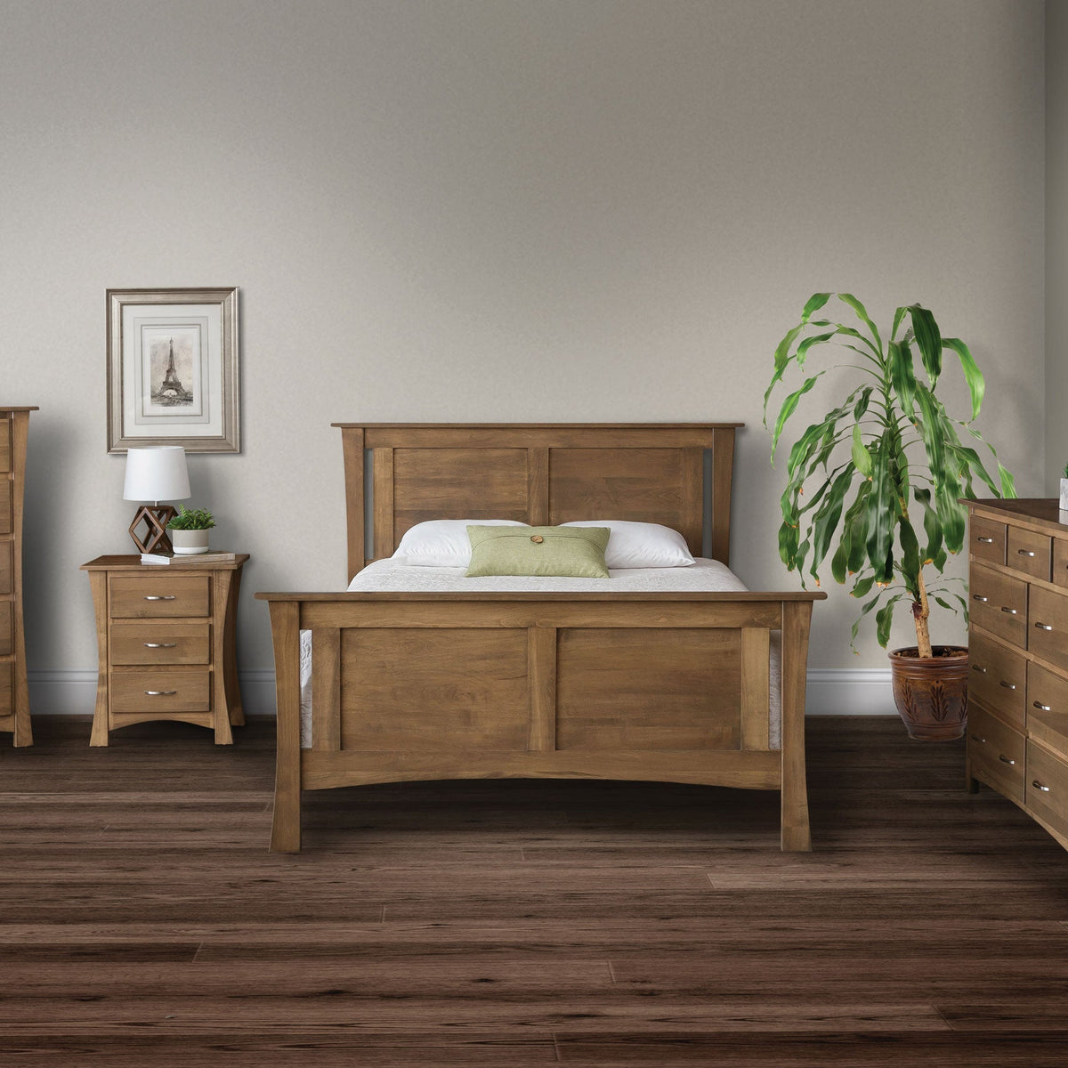 Panel bed in a driftwood brown finish flanked by a curved leg nightstand and chest of drawers