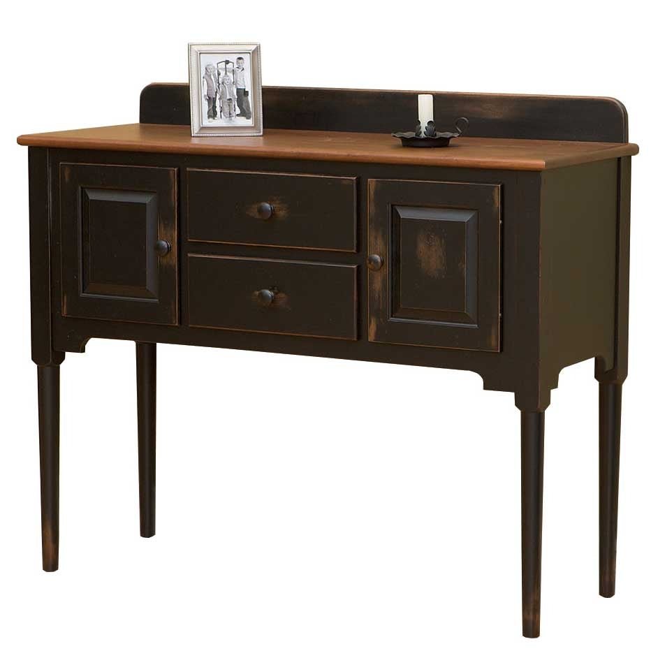 Angled view of the two-tone black sideboard showing its oak plank top, gallery rail, drawers and paneled doors