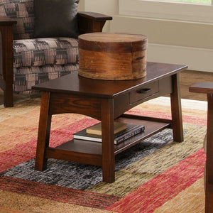 Santa Fe coffee table in dark brown with drawer, holding a wooden pantry box with atlas books on the lower shelf