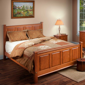 Raised panel bed in cherry with matching four panel headboard and footboard styled with autumn bedding
