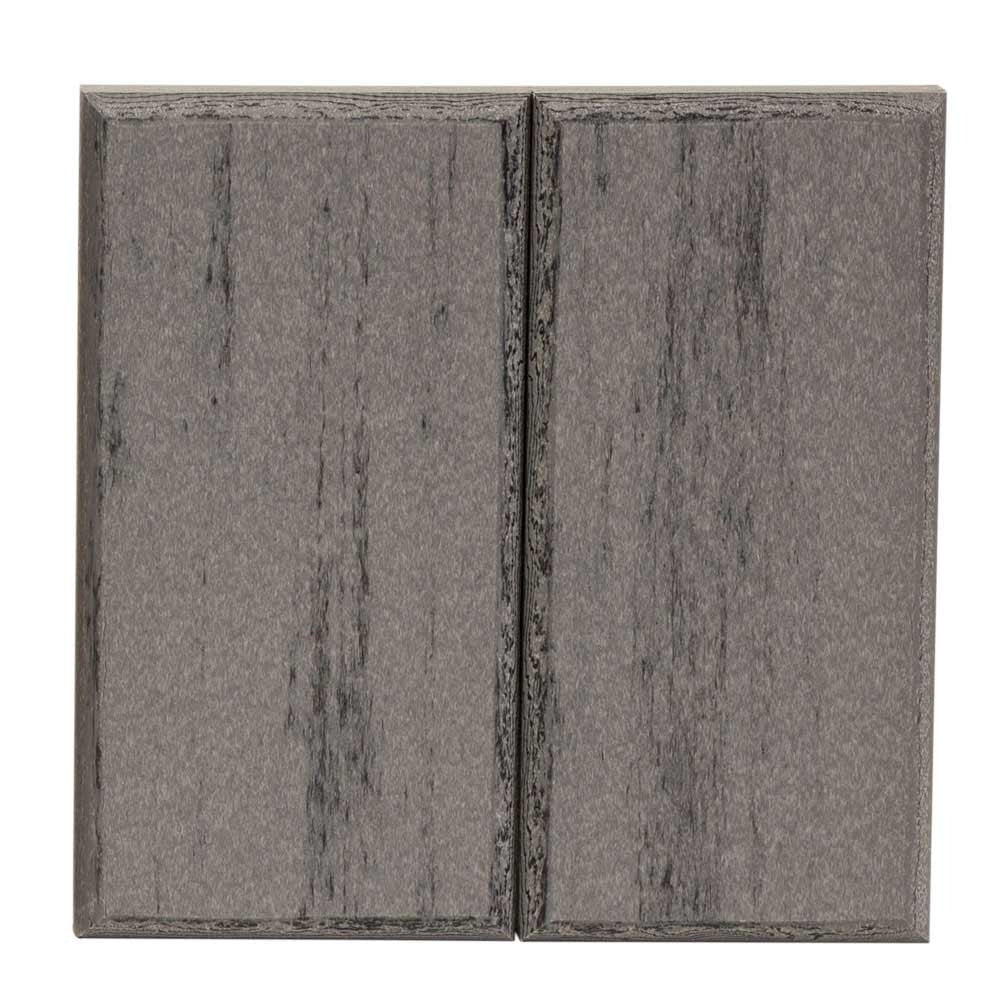 Two piece weathered gray poly lumber sample showing a driftwood woodgrain texture with dark streaks