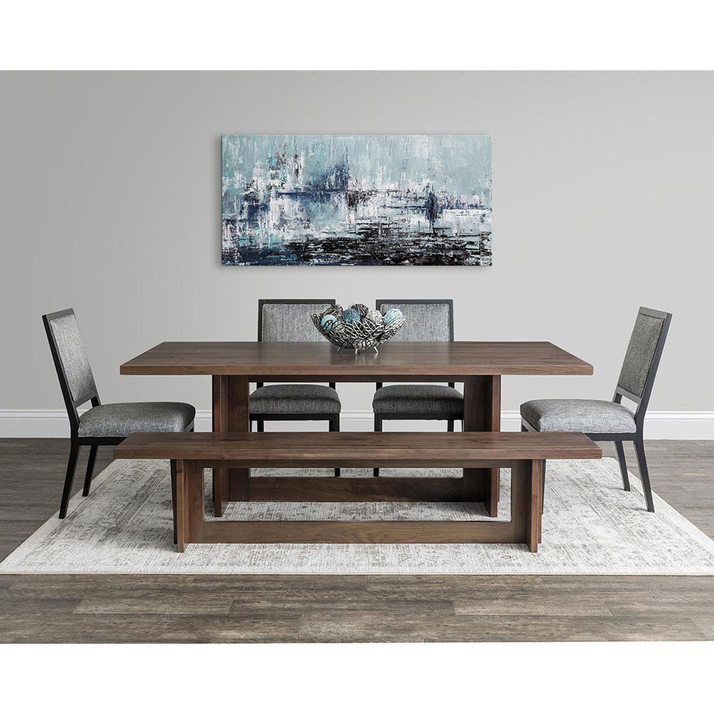 Modern walnut dining set with rectangular plank top table, gray upholstered chairs and matching bench under abstract art