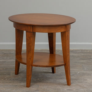 Oval end table in a warm cherry finish with four tapered legs and an oval lower display shelf